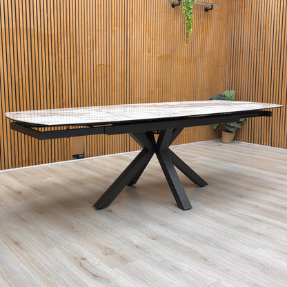 Lifestyle shot of the table legs and steel frame with a durable lacquered finish.