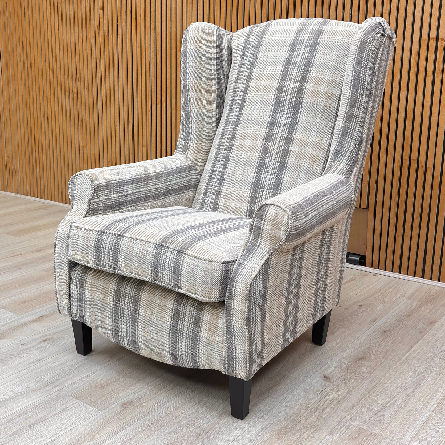 Lifestyle view for the Shirley large accent chair, highlighting the durable checkered Winchester fabric, premium seat cushioning, and timeless traditional design.