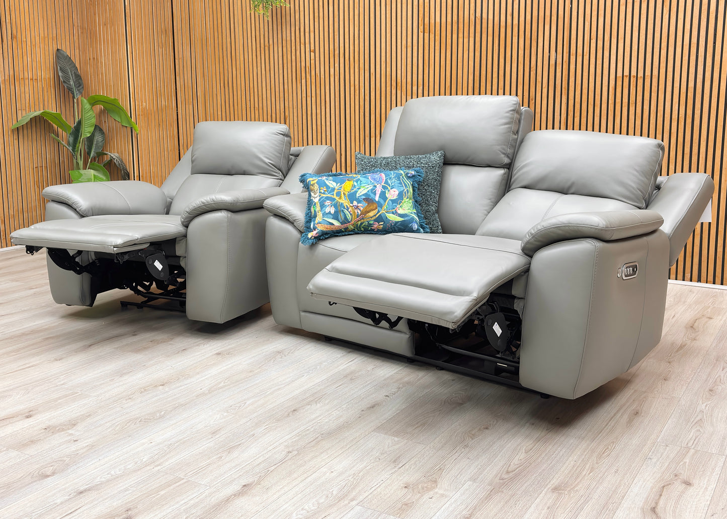 Lifestyle view of the Utah power recliner sofa and chair in a reclined position.