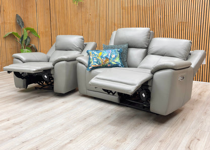 Lifestyle view of the Utah power recliner sofa and chair in a reclined position.