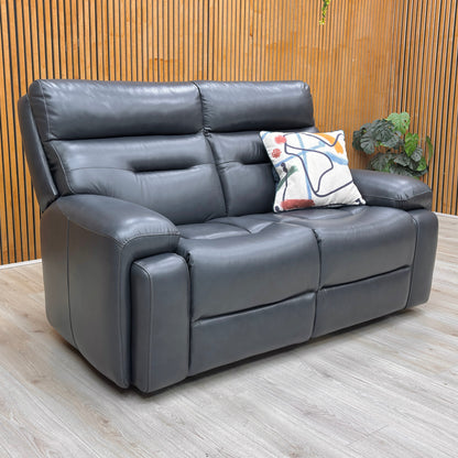 Lifestyle view of the Cinemax 2-seater sofa, highlighting the 100% genuine Navy Blue leather, durable frame construction, and superior lumbar support.