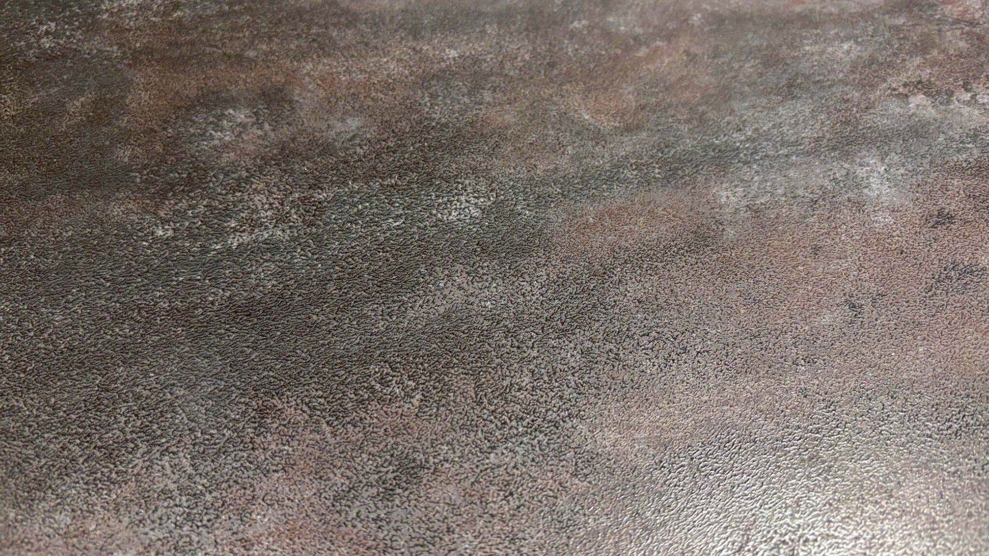 Textured brown surface of a dining table with a gradient effect
