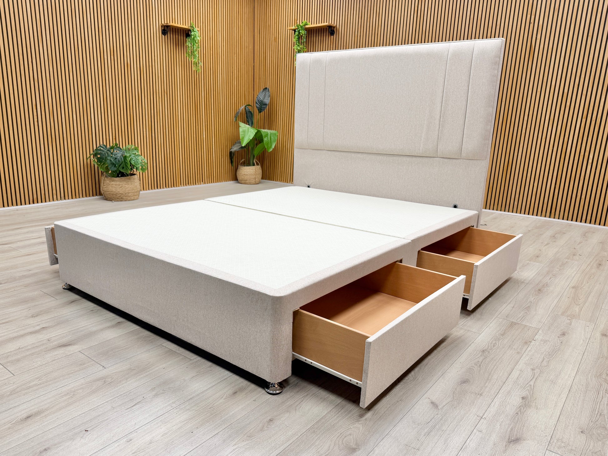 Life style view of the complete king-size bed set, showing the clean lines of the divan base and the tall, sturdy headboard