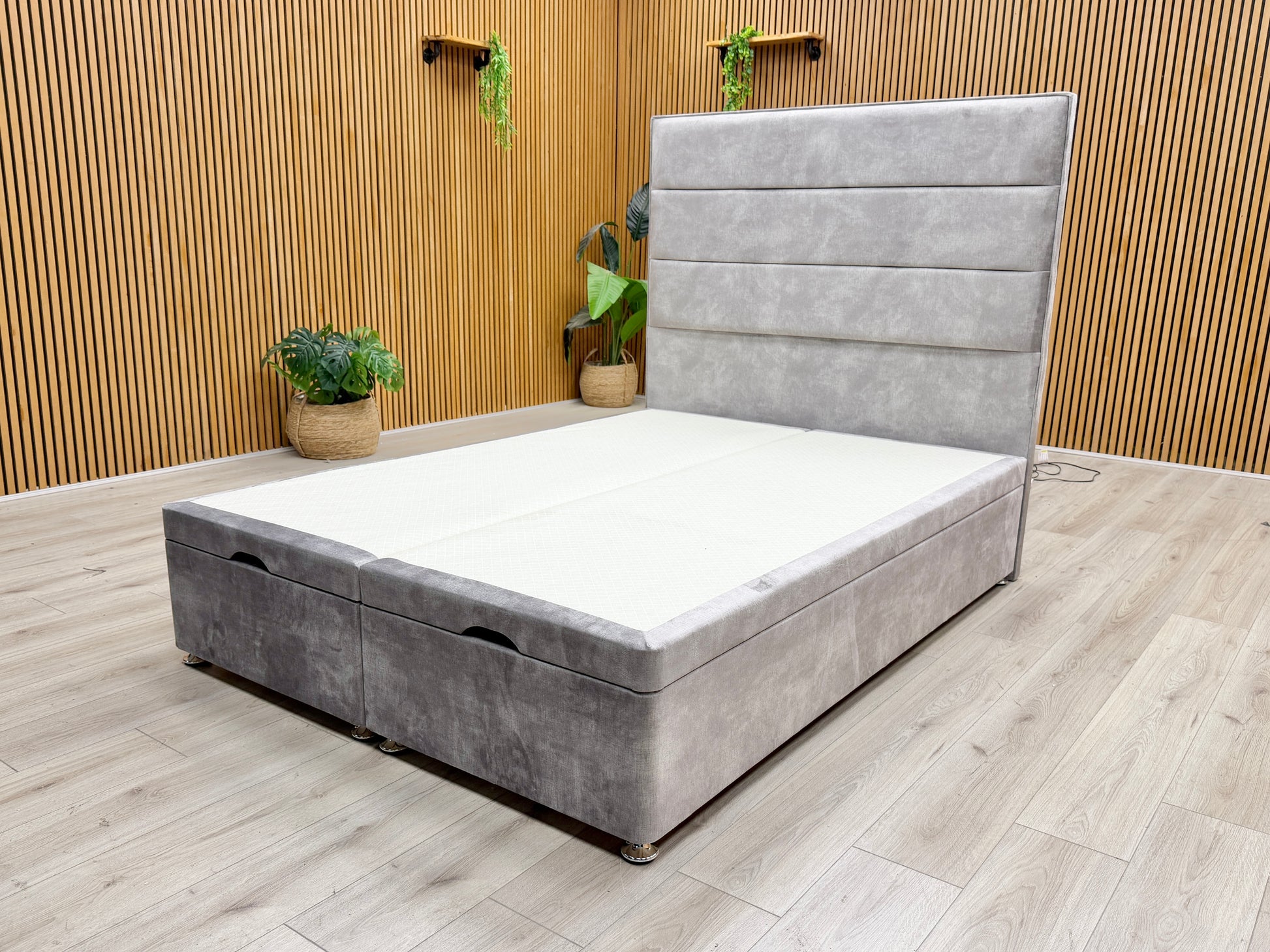 Image of the double end-lift ottoman base in the open position, demonstrating the vast hidden storage space for bedroom essentials.