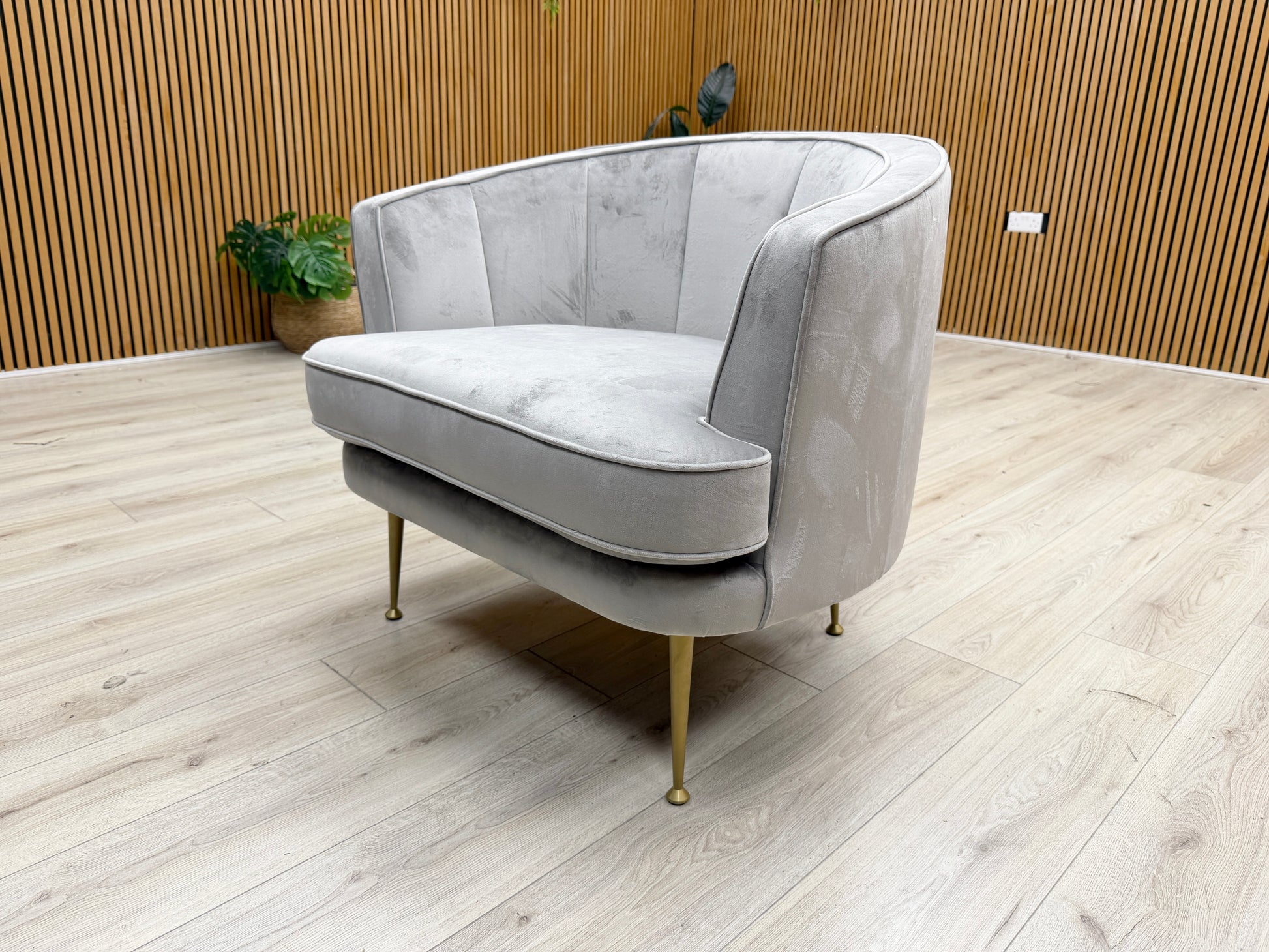 Lifestyle shot of the ‘Enchanted’ accent chair in a contemporary living space, showing its stylish presence and compact design.