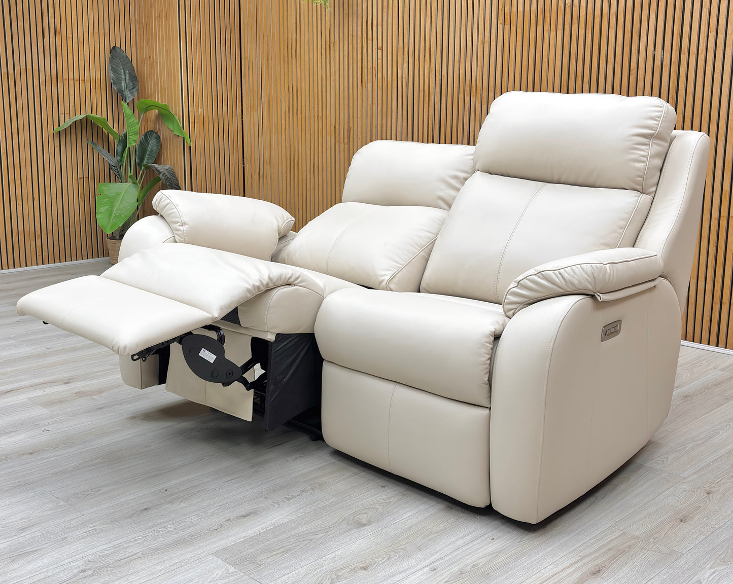 Lifestyle view for the G Plan Kingsbury 2-seater, highlighting the 100% top-grain Cambridge Stone leather, power-assisted lumbar support, and independent headrest adjustment.