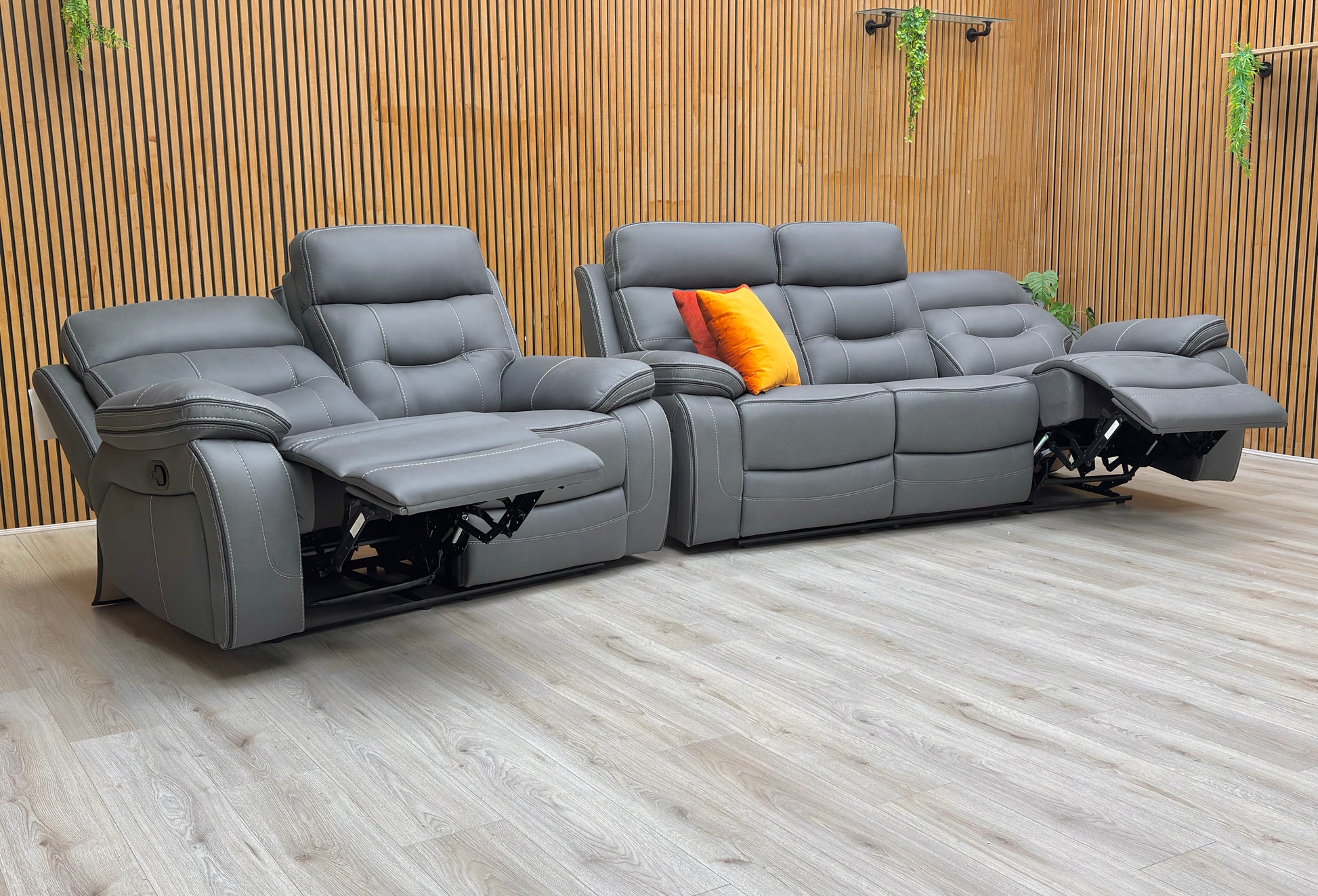 Lifestyle view of the Dante 3-seater and 2-seater set, showcasing the coordinated contemporary design and the deep-filled cushions in neutral grey.
