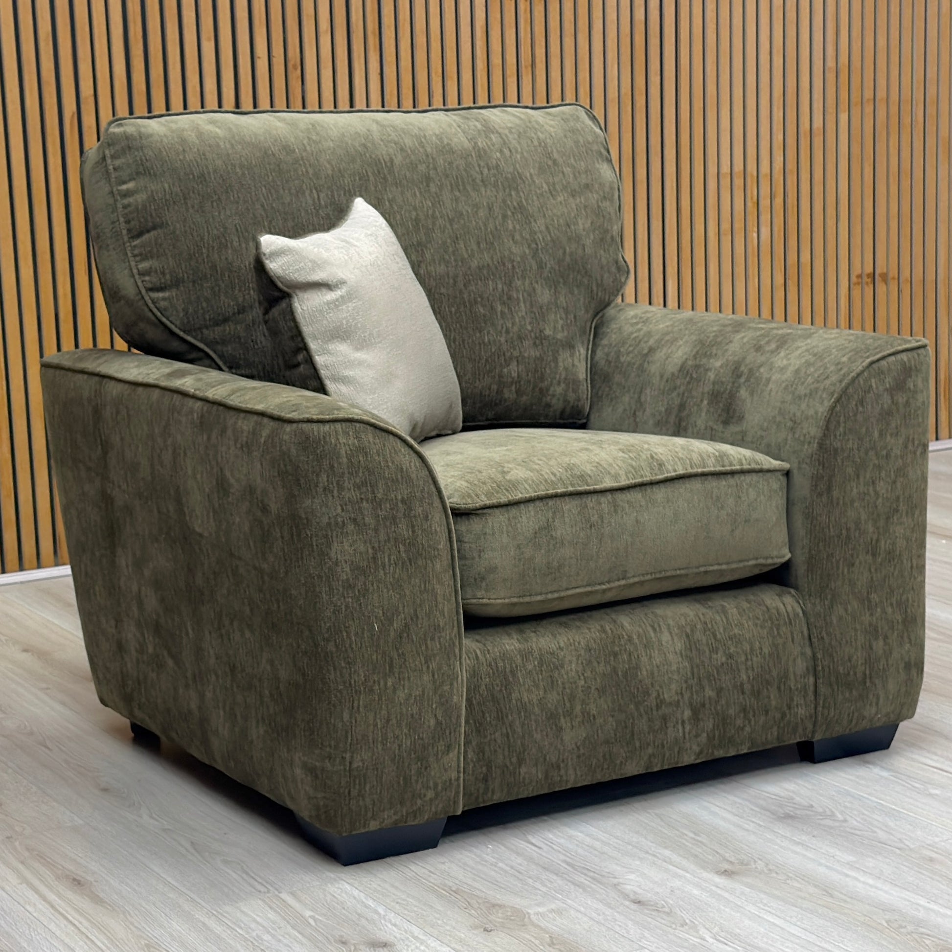 Side view of the Harvey armchair, showing the clean lines of the back and its compact footprint suitable for any room
