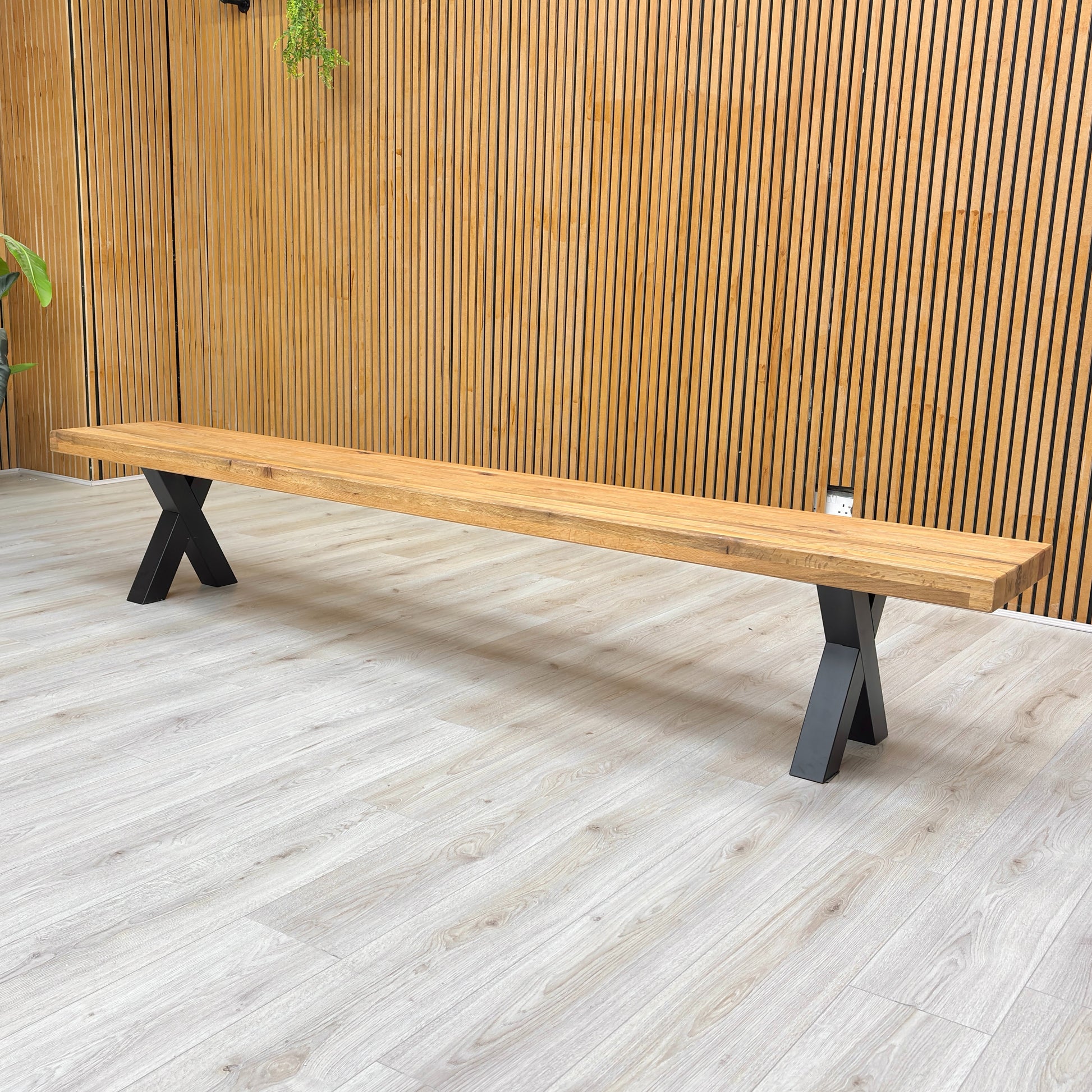 Angled view of the bench, focusing on the leg structure.