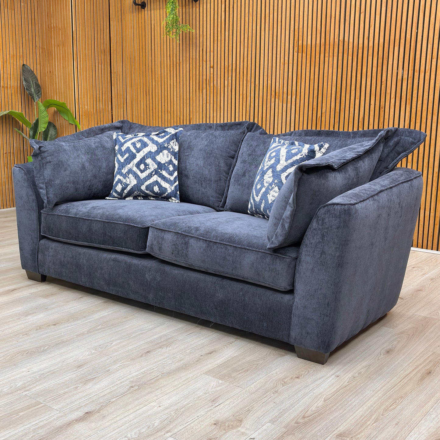 Lifestyle view of the Finchley sofa, showcasing the rich blue textured weave and the spacious, plush design suitable for modern living rooms.