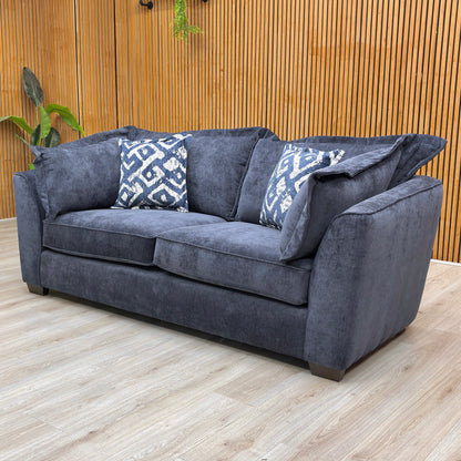 Lifestyle view of the Finchley sofa, showcasing the rich blue textured weave and the spacious, plush design suitable for modern living rooms.