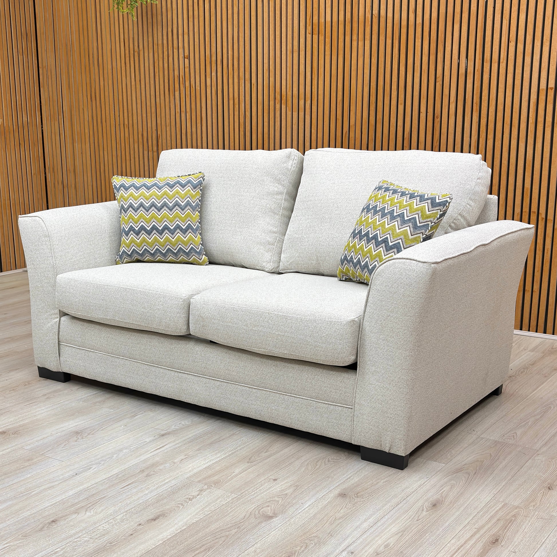 Lifestyle view of the Cream woven Albany sofa bed styled in a modern living room setting, showcasing its compact and elegant space-saving design.