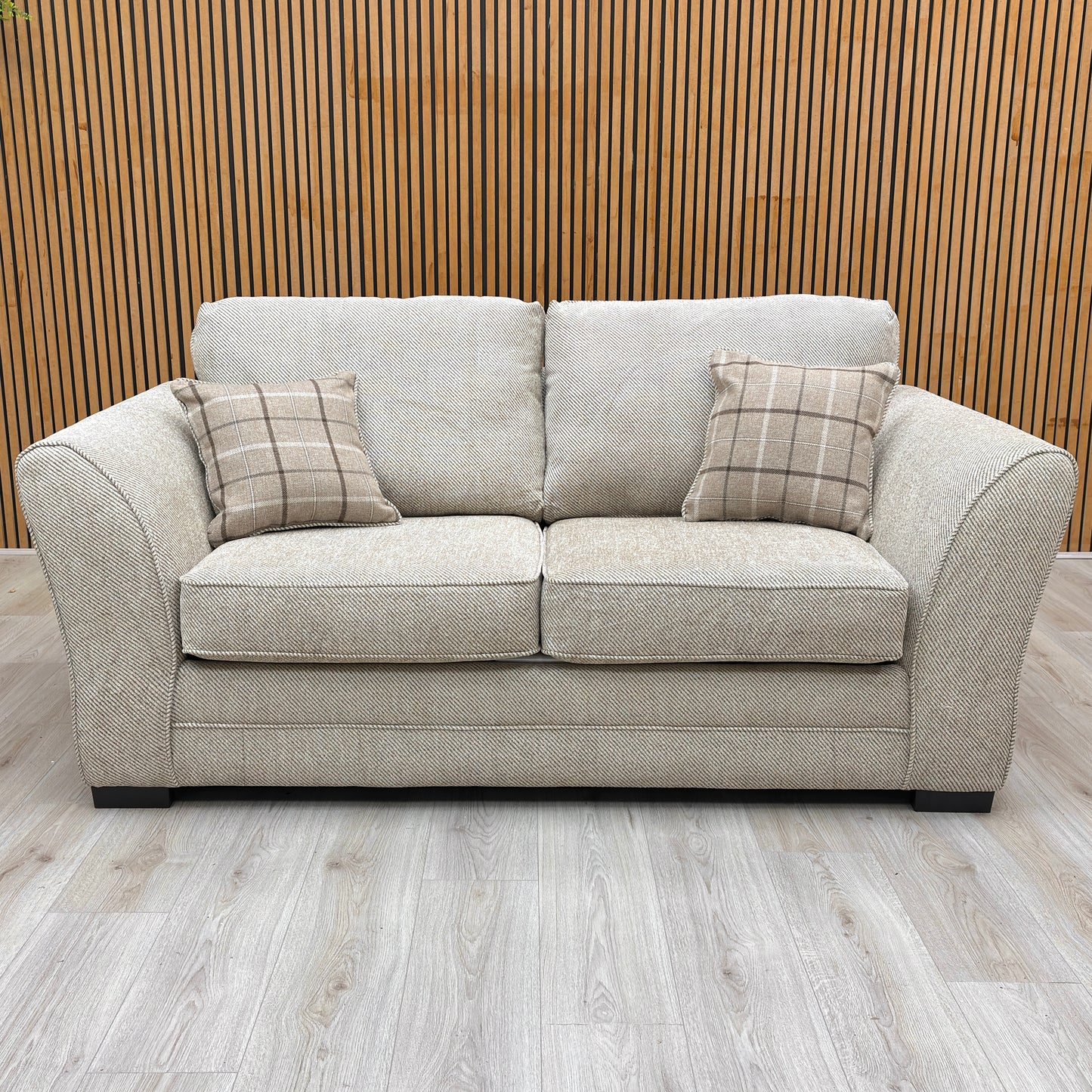 Fully upholstered front view of the Sophie Sultan sofa bed in oatmeal woven fabric, suitable for open-plan placement.