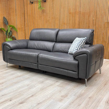 Lifestyle view of the soft 100% Jet Black leather upholstery, highlighting the piped edges, understated buttoning, and high-quality grain.