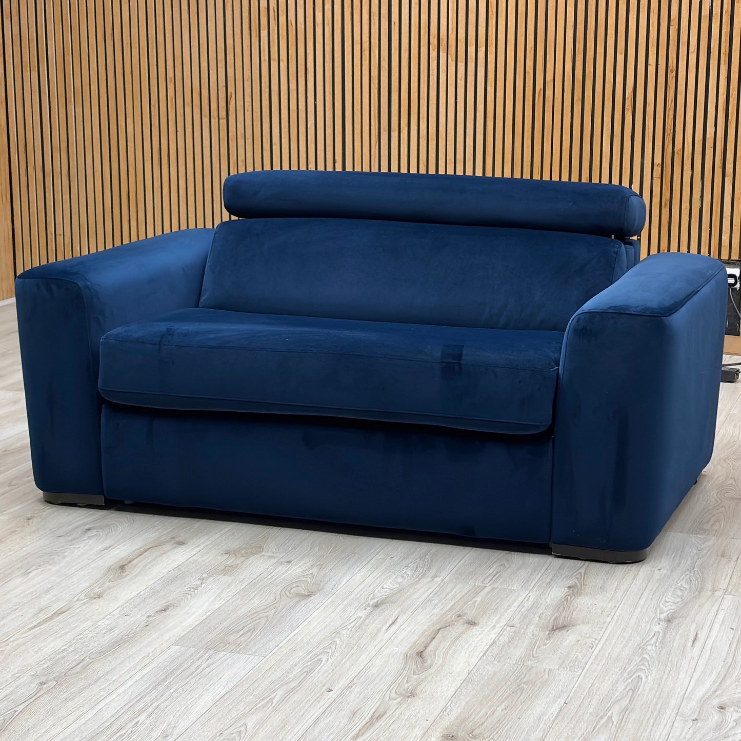 Studio view of the Infinity large armchair in its standard seating configuration, showcasing its wide layout, thick supportive cushions, and neat uniform tailoring.