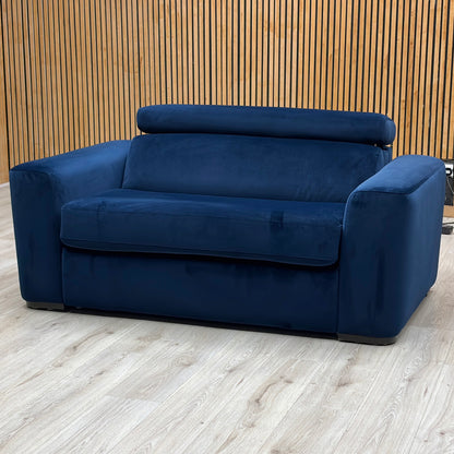Studio view of the Infinity large armchair in its standard seating configuration, showcasing its wide layout, thick supportive cushions, and neat uniform tailoring.