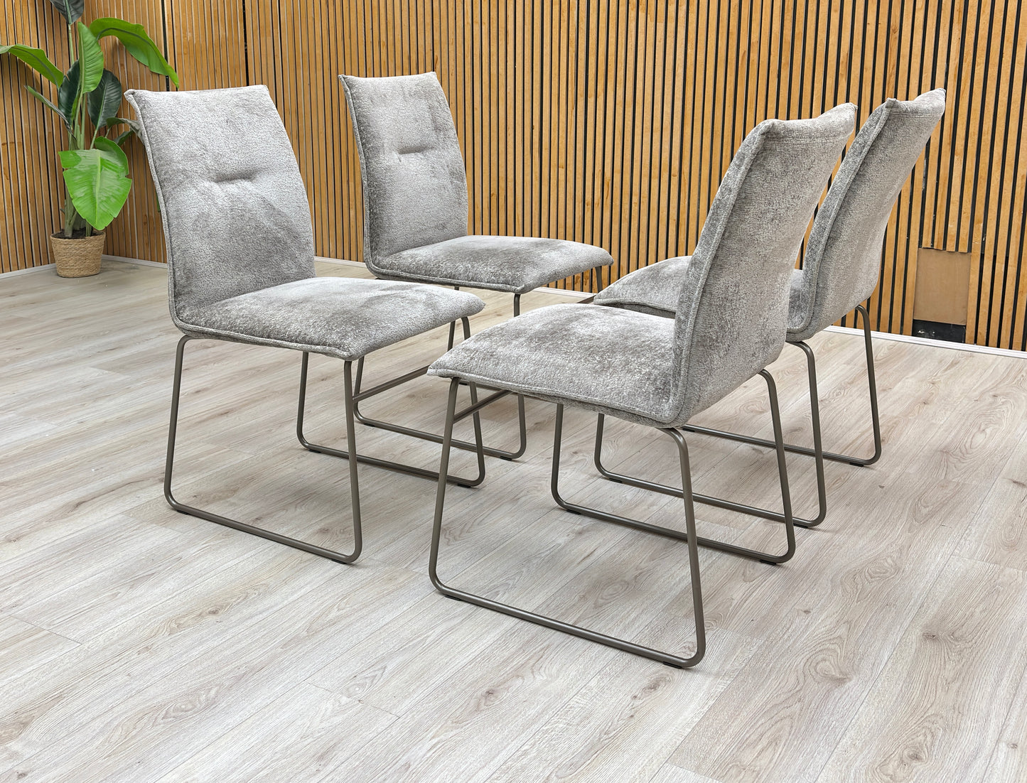 Lifestyle view of the Connubia 'Maya' dining chair set brings sophisticated Italian design and contemporary comfort to any dining space.