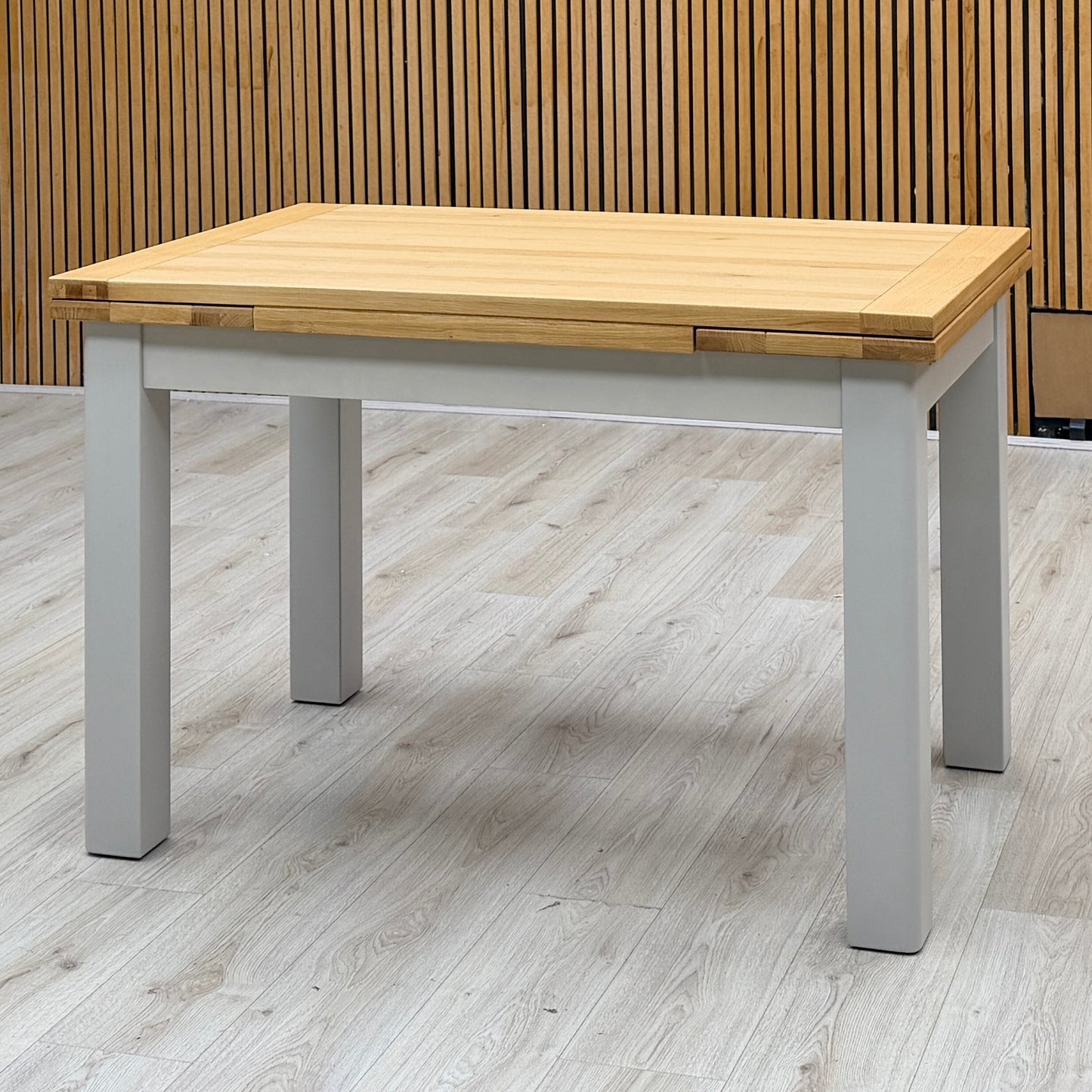 ‘Lewis’ Solid Oak 120cm Large Draw Leaf Extending Dining Table with Dark Grey Faux Leather Roll Back Dining Chairs – view 3