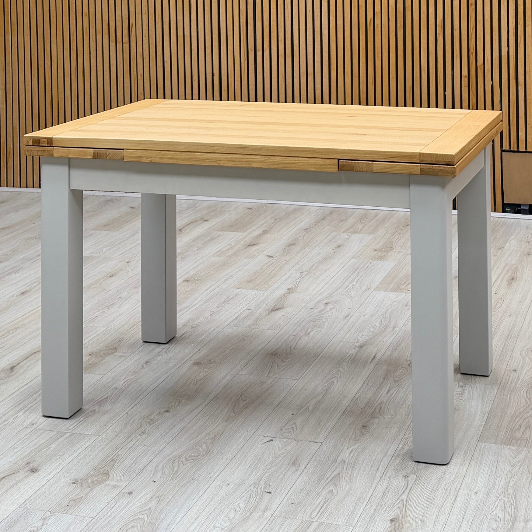 ‘Lewis’ Solid Oak 120cm Large Draw Leaf Extending Dining Table with Dark Grey Faux Leather Roll Back Dining Chairs – view 3