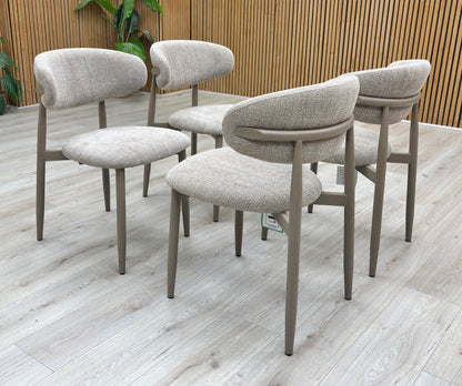Lifestyle view of the Aimar dining chair emphasizing the elegant curve of the backrest and sturdy leg construction.