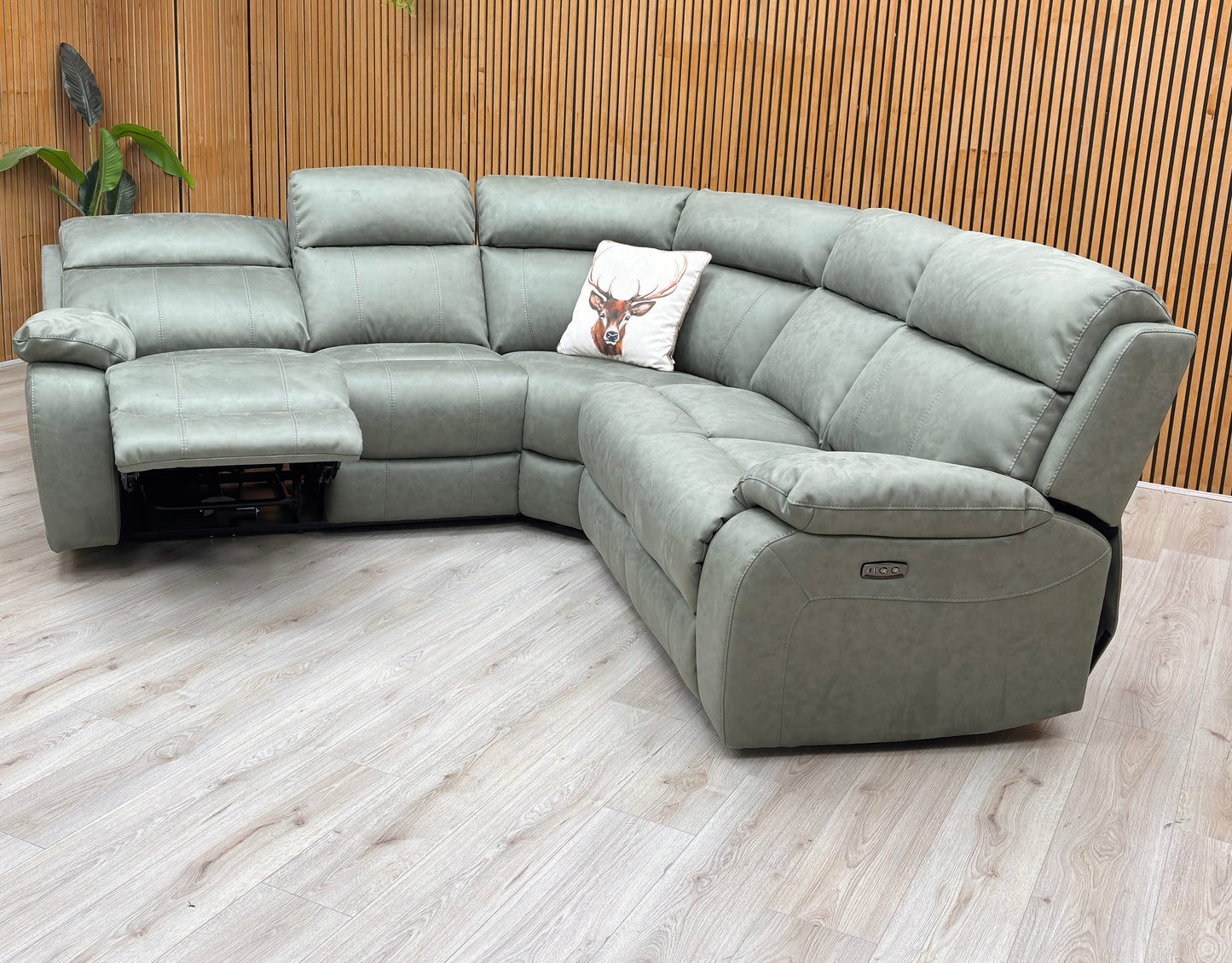 Lifestyle view of the Moreno 2-corner-2 sofa, showcasing the deep olive green tone and the plush, supportive lumbar cushioning.