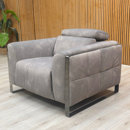 Lifestyle shot of the Gisella mocha grey fabric chair in a minimalist, high-end living room environment.