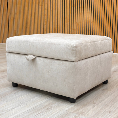 Lifestyle view of the truffle storage footstool paired with a matching sofa in a living room setting.