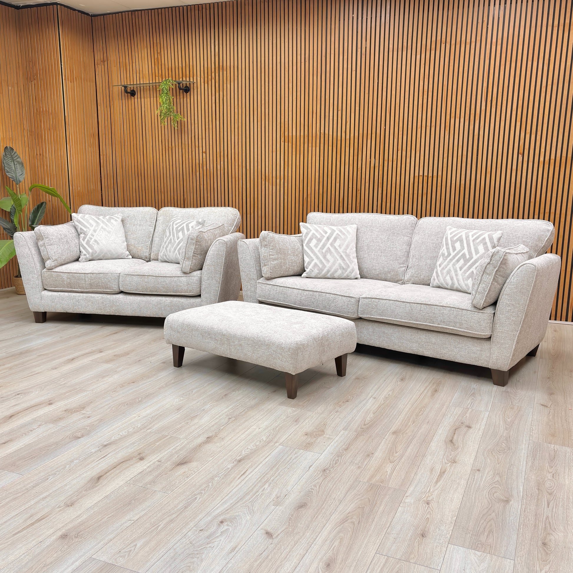 Angled view of the Tabitha 3 Seater Sofa and matching Bench Stool, emphasizing the super-soft chenille upholstery.