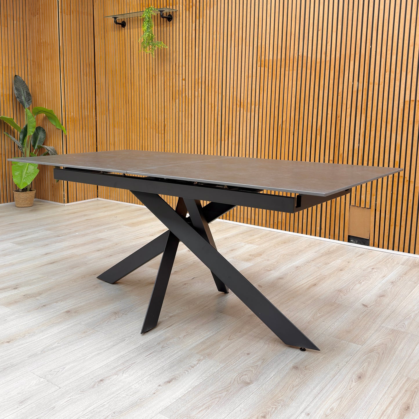 Lifestyle view of the Warrior table top highlighting the natural industrial grey texture of the sintered stone.