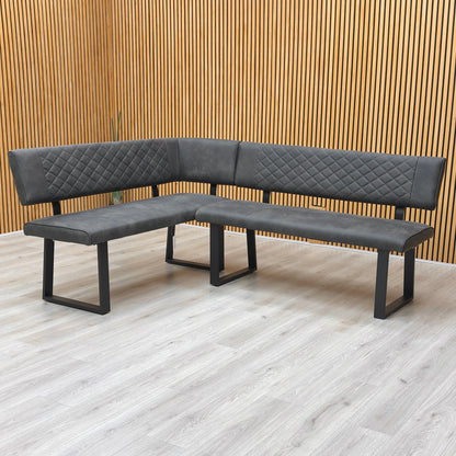 Lifestyle view shot showing the left-hand facing configuration of the Warrior bench, emphasizing the modern industrial aesthetic and generous seating area.