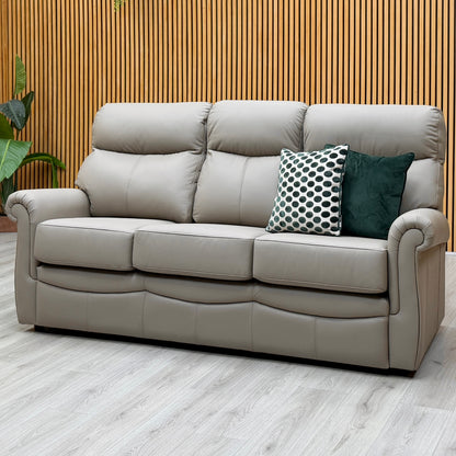 G Plan Avon taupe leather 3 seater sofa against a slatted wooden wall on a light oak floor