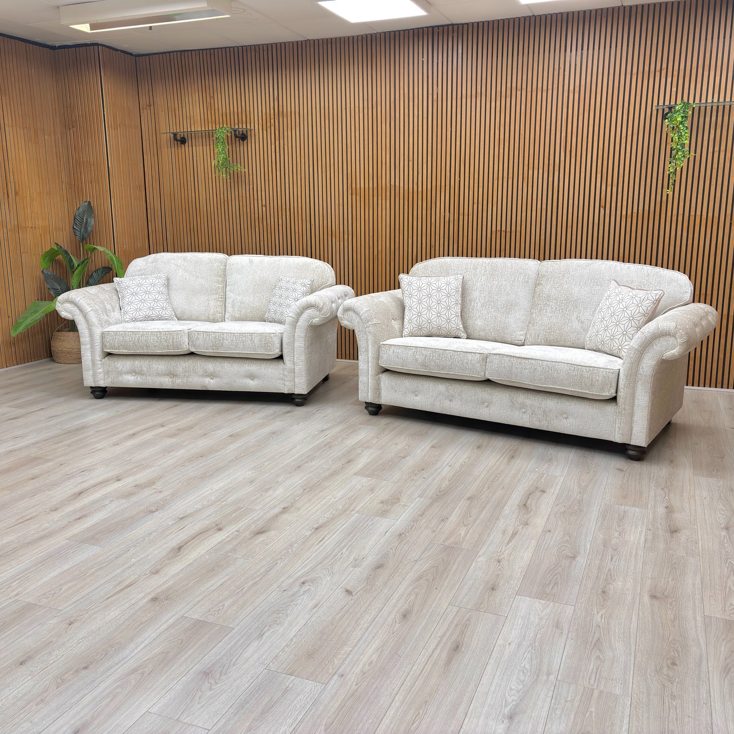 Lifestyle shot of the sofa set in a room setting, showing both pieces.