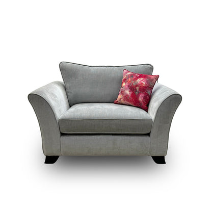 Front view of the 'Sasha' snugger armchair in soft light grey velour fabric, featuring deep-buttoned detailing and elegant dark wood legs.