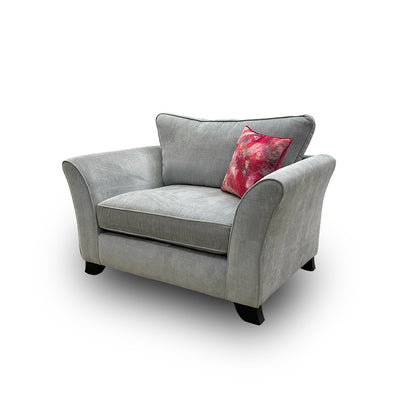 Side view of the Sasha chair, showcasing the sophisticated sheen of the light grey velour and the classic chesterfield-inspired rolled arms.