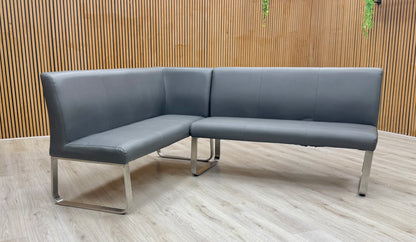 Lifestyle view of Cocoon corner bench styled in a contemporary dining or lounge area, maximizing seating capacity in a corner layout.
