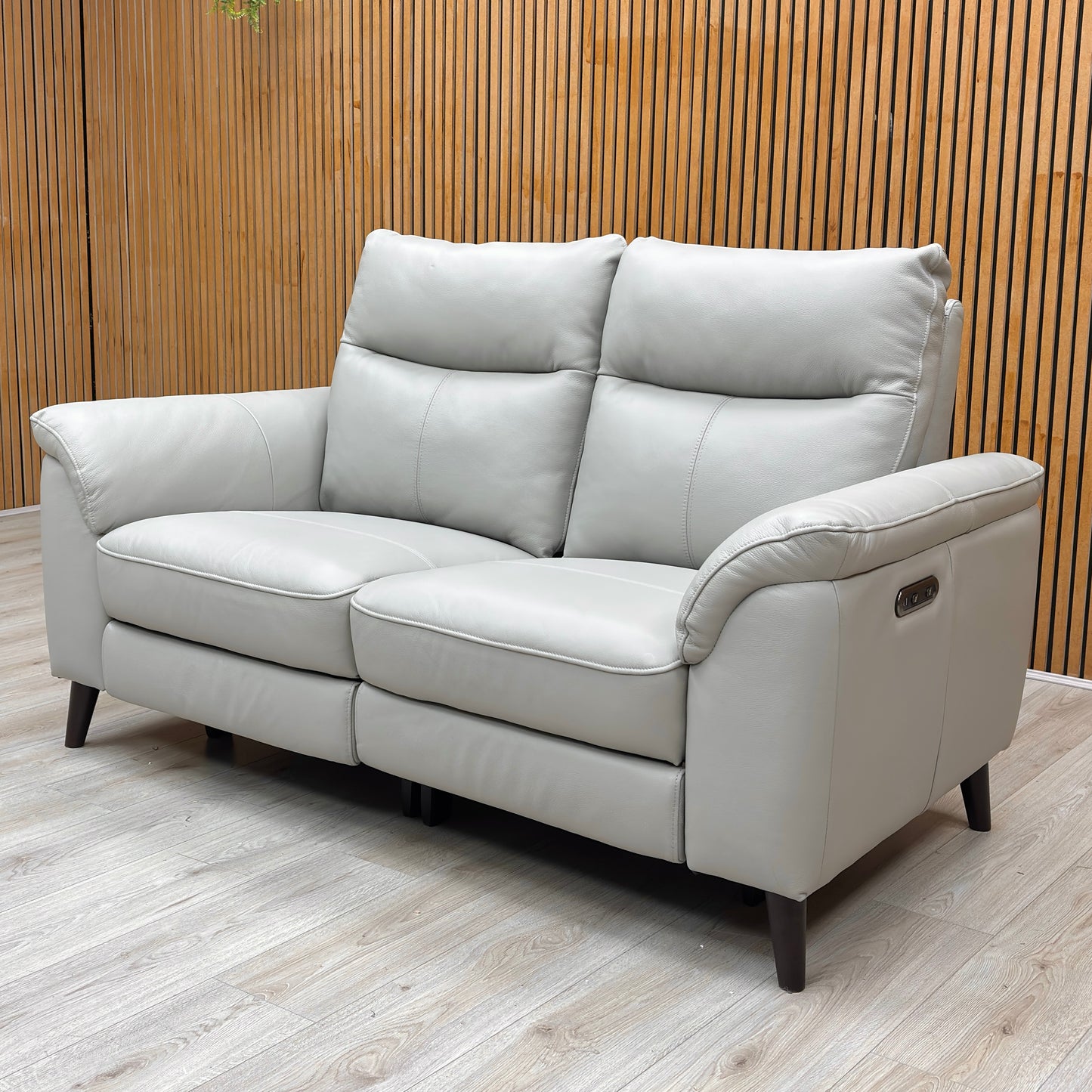 Side profile of the 2-seater sofa, showcasing the deep cushioning and the clean, modern silhouette of the frame.