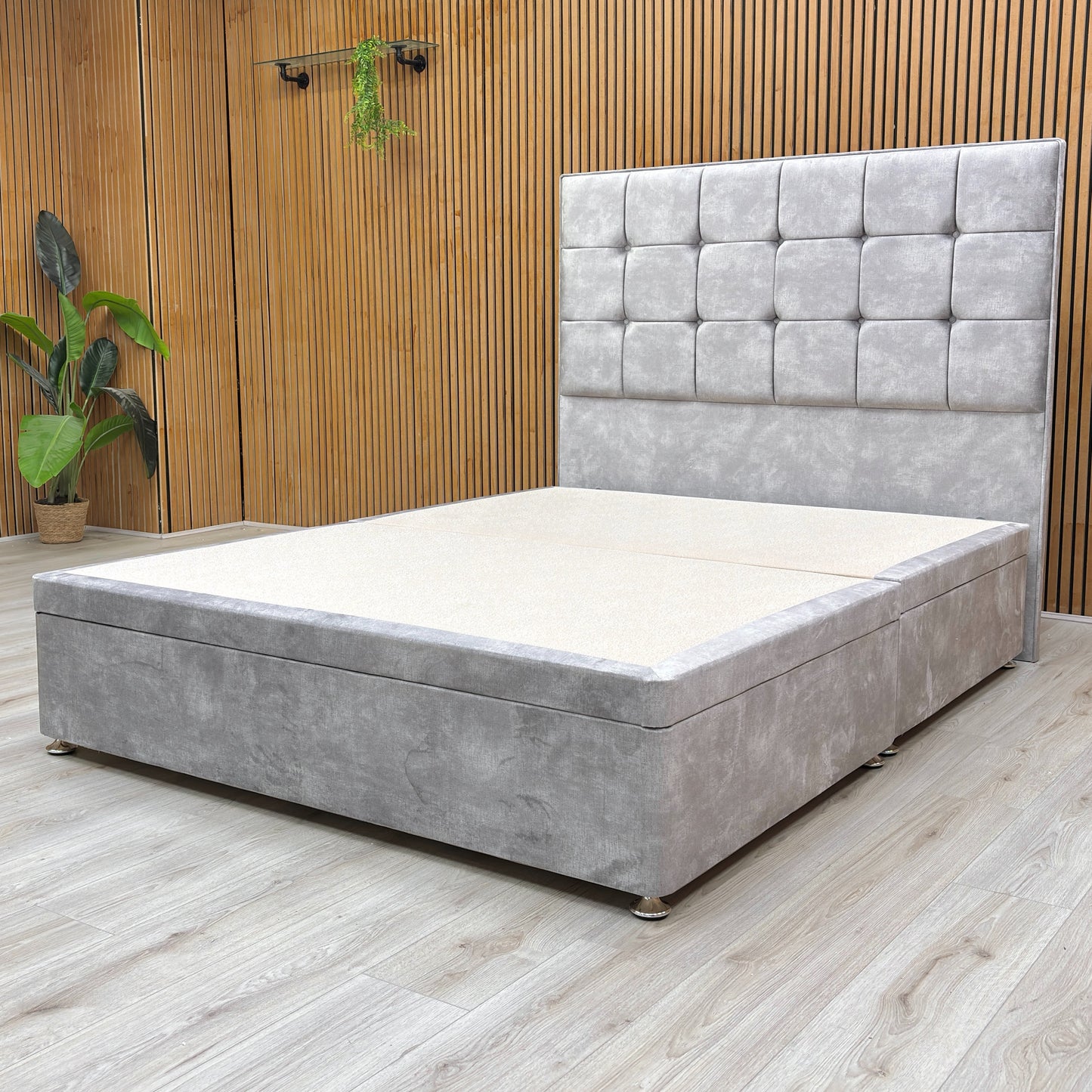 Lifestyle shot of the bed in a decorated bedroom, highlighting the plush texture of the Dolphin Velvet fabric.