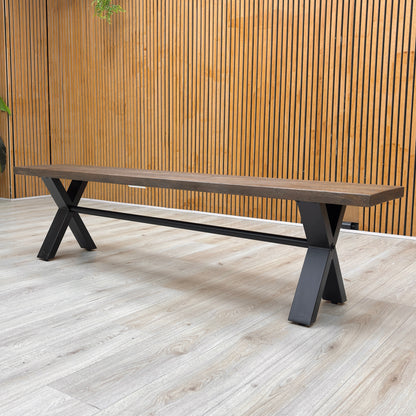 A side-angle shot of the bench, highlighting the contrast between the natural dark wood top and the sturdy black metal base.