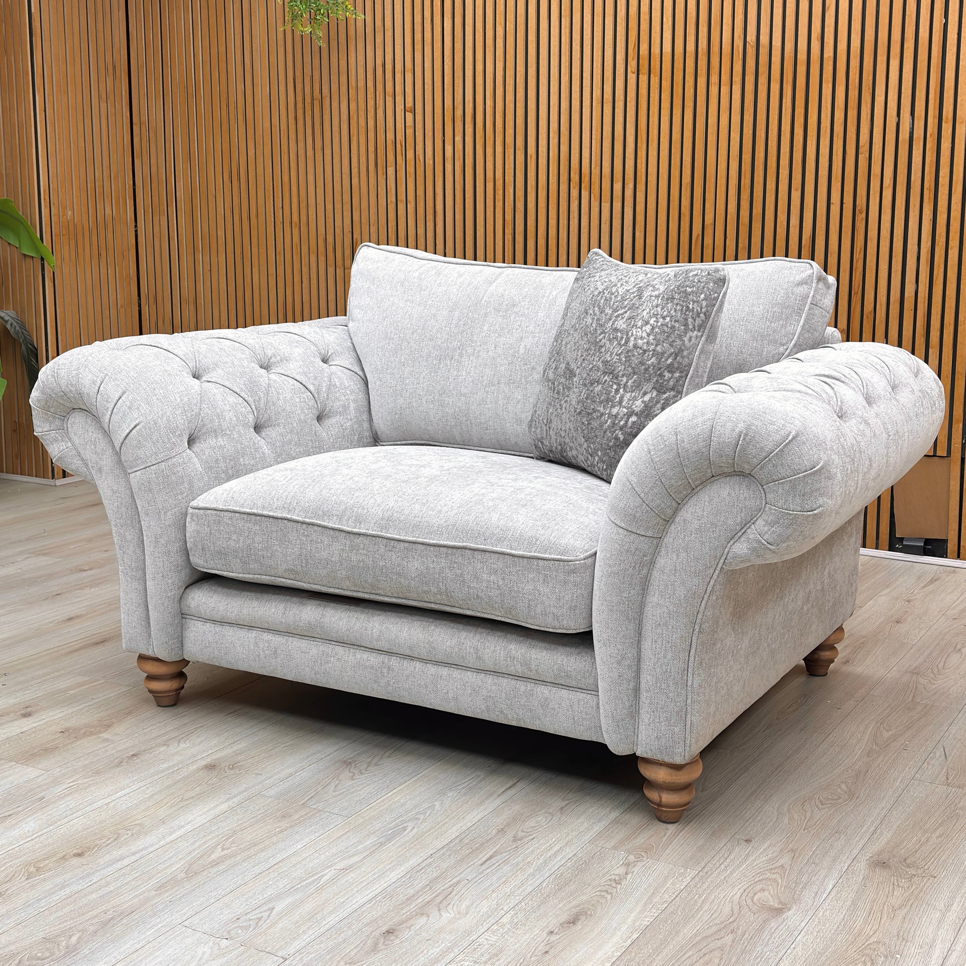 Rear view of the snuggler chair, showing the neat upholstery finish and sturdy frame construction.
