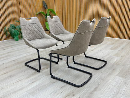 Lifestyle view of the taupe fabric upholstery showing the quilted-effect stitching and textured weave.