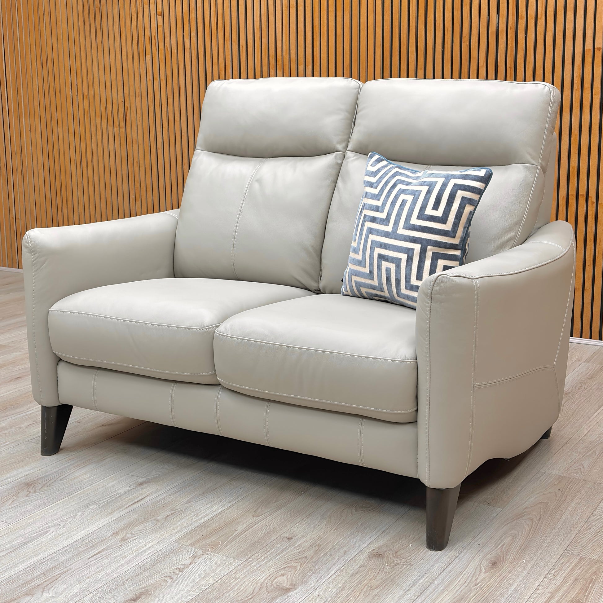 Rear view of the compact 2 seater sofa, illustrating its neat finish and ability to fit flush against a wall.