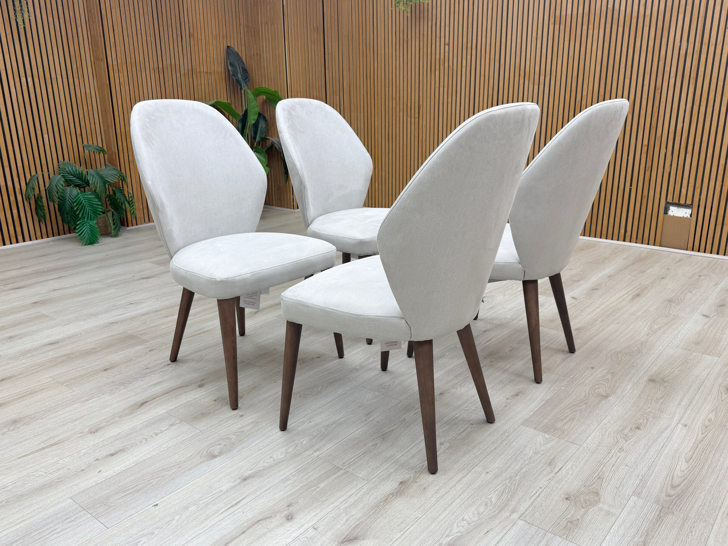 Lifestyle view photograph showing the soft-touch Satin Light Grey fabric texture and quality stitching of the Empire chair.