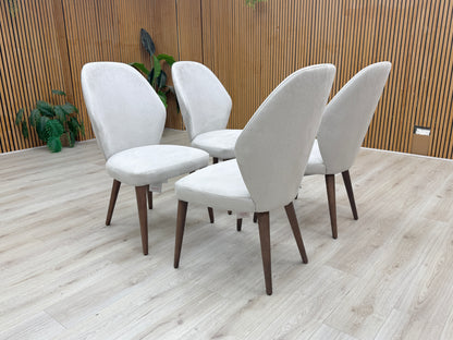 Lifestyle view photograph showing the soft-touch Satin Light Grey fabric texture and quality stitching of the Empire chair.