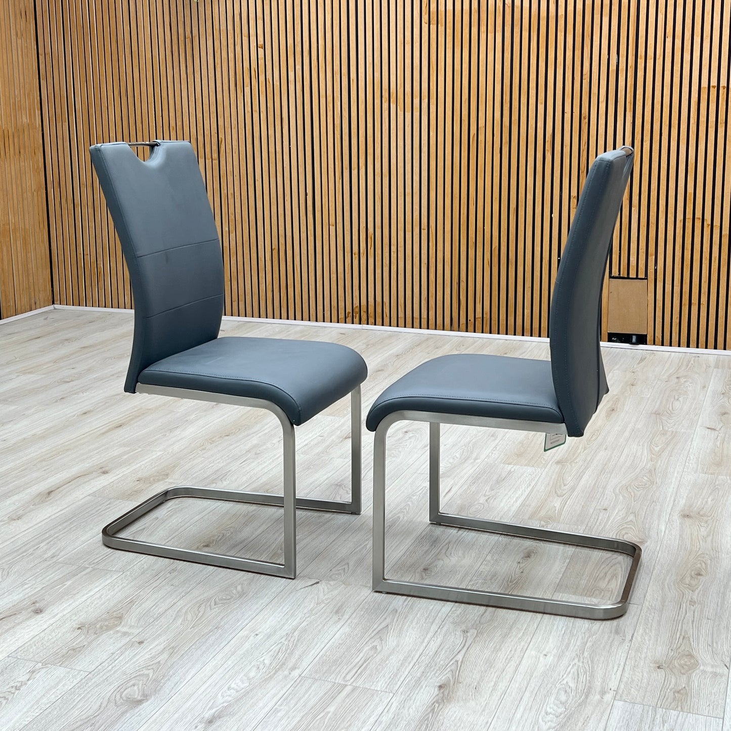 ‘Bianco’ Grey Faux Leather Cantilever Pair of Dining Chairs