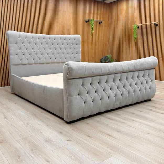 Lifestyle view of the Lance bed frame in the open position, showcasing the side-lifting base and the sturdy internal storage area.