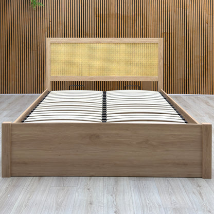 Hamish oak king size end lift ottoman bed on a light oak floor against a slatted wooden wall