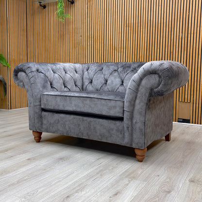 Lifestyle view of the Gosford Snuggler, showcasing the oversized seat and the rich, dark grey tones of the fabric.