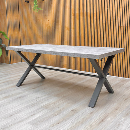 Lifestyle view of the Moon 190cm table, showcasing the spacious 8-seater surface and the architectural metal leg design.