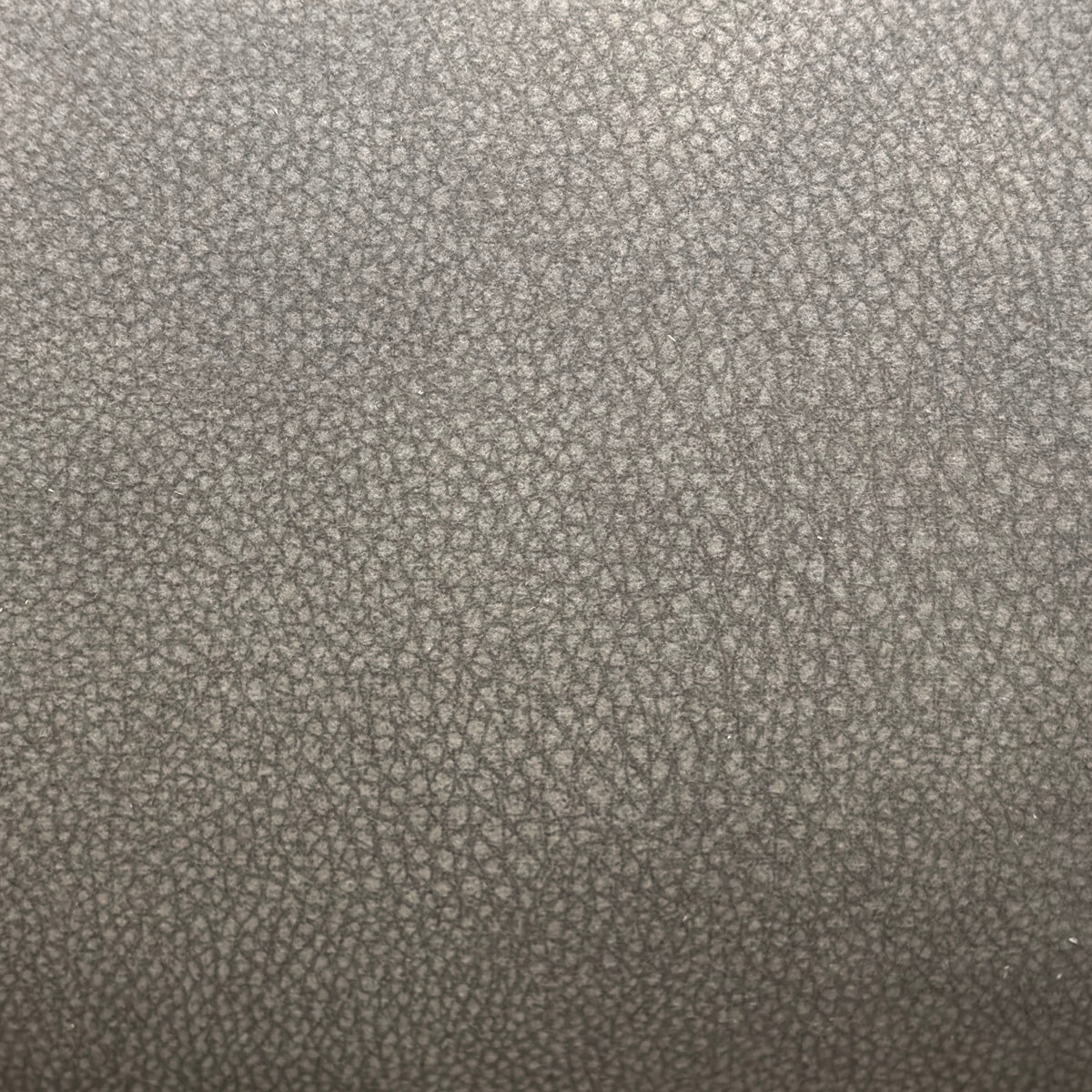 Close-up of the storm grey microfiber fabric used on the Linea 2 seater power recliner sofa