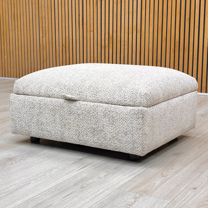 Lifestyle view of the Hudson storage stool with the lid open, revealing the spacious internal compartment designed for storing blankets, cushions, or magazines.